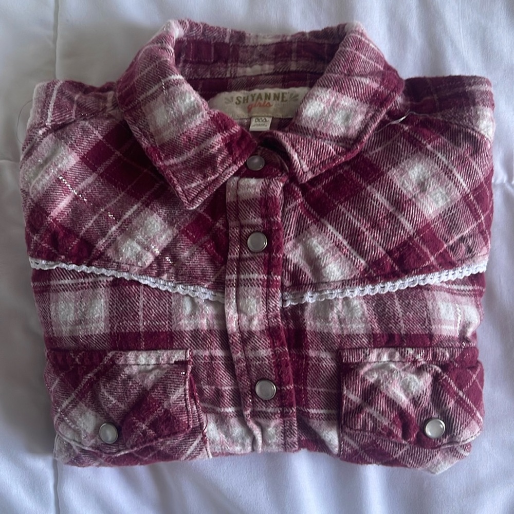 Girls flannel long sleeve western style shirt with pearl snaps brand is Shyanne